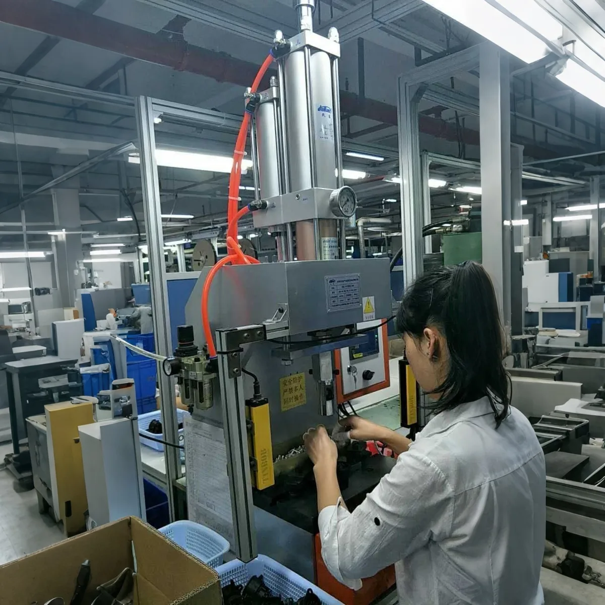 JRA hydro-pneumatic cylinder press-fitting an electronic component into a housing